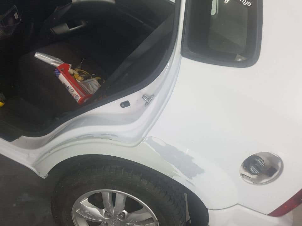 The same wheel arch repaired and painted