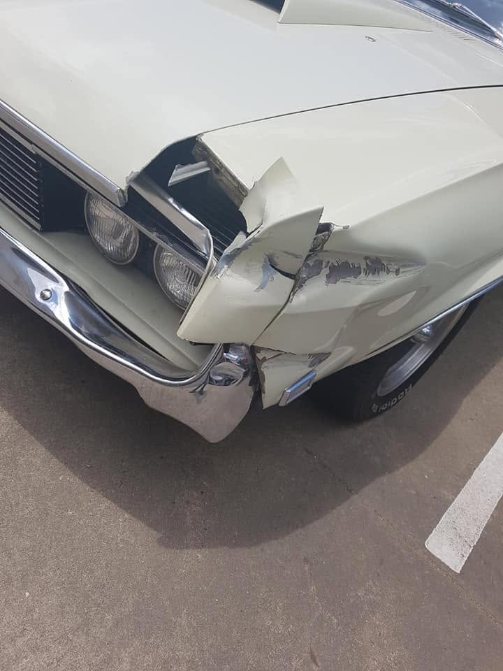 Front-end damage on a 1960s classic car before repair