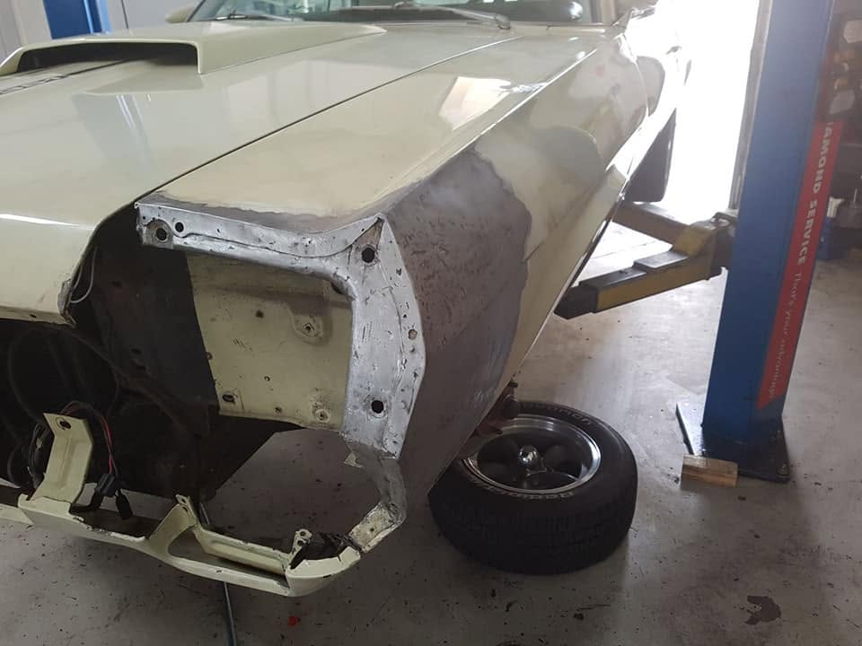 A classic car with a new hand-made panel fitted to the front quarter